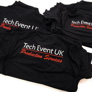 Photo of black polo shirts with Tech Event UK Production Services branding