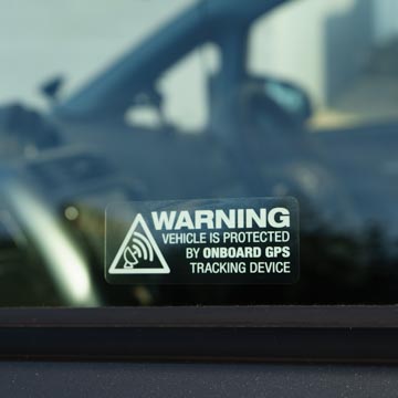 Photo showing GPS warning window sticker which reads this vehicle is protected by onboard GPS tracking device